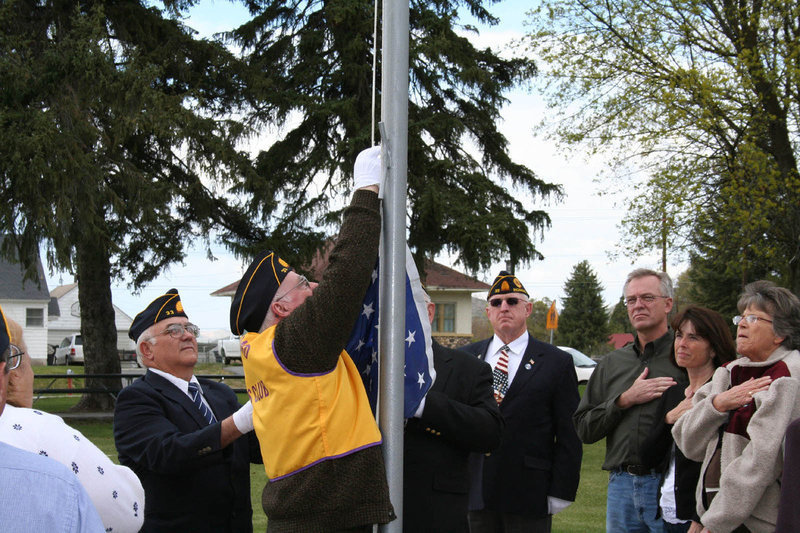 Image: Flag Raising — American Legion Richmond Post members raising the flag.