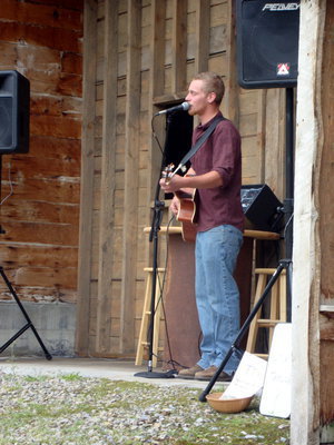 Image: Bluegrass — Dylan Taylor plays a mix of bluegrass and country music for customers to listen to.