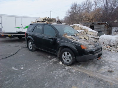 Image: Skid marks — The SUV was slid back about twenty feet to clear away the rubble and allow the trackhoe operator to finish demolishing the building.