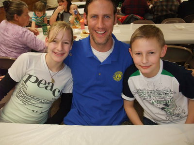 Image: Downs family — Madison, Matthew and Carter Downs enjoying dinner at the Lions Club.