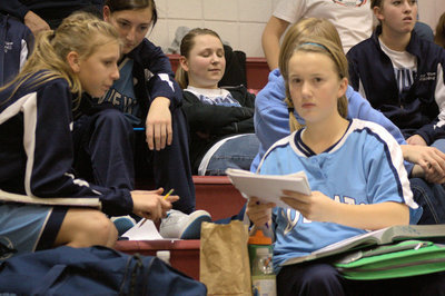 Image: Freshman, Sophomore, &amp; JV players doing homework at halftime