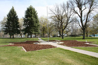 Image: Star Garden — The newly restored Star Garden and flagpole. The Richmond Lions Club, Youth Council, and City Council with help from several Scouts and the city maintenance workers did the work of digging up the old weed barrier, putting down new barrier, transplanting tulips, and putting in fresh mulch. When the danger of frost is past, a variety of perennials will be planted to provide color throughout the year.