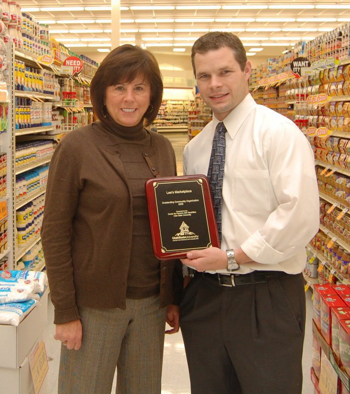 Image: Shari and Jonathan Badger — Shari and Jonathan Badger accept the Center for Persons with Disabilities’ Outstanding Community Organization award for 2009.