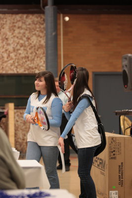 Image: Students demonstrate auction items