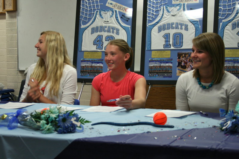 Image: Aubry Boehme, Taylor Rock and Nicole Hansen — Aubry Boehme, Taylor Rock and Nicole Hansen getting ready to sign their letters of intent to Otero Junior College in LaJunta, Colorado.