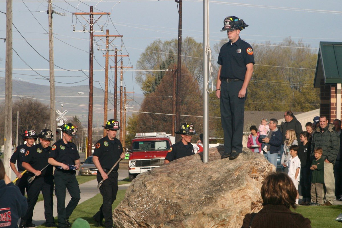 Image: Color guard — The flag raising ceremony in front of the Smithfield fire station.