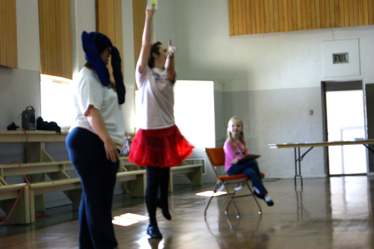 Image: Volunteers at the Dr. Seuss Celebration perform a dance number for the story “Elephants Can’t Dance”