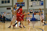 Image: Courtney Ballard (#15) blocking as Dannika Webb (#5) passes