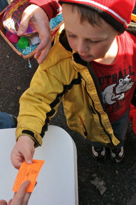 Image: Free meals — Area businesses handed out free meals, prizes and even $2 bills to every child with an egg.