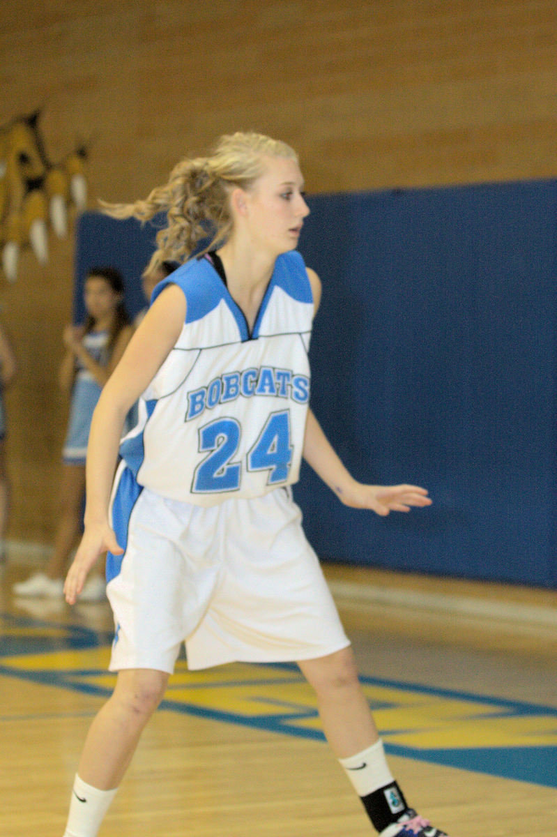 Image: Whitney Alvey (#24) defending the inbound pass