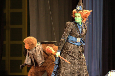 Image: Wicked Witch of the West (Skyler Little) with the leader of the Flying Monkeys Nikko (Paige Goodwin)