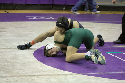 Image: Brandon Burger working on a pin at the Divisional Tournament