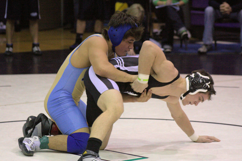 Image: Abraham Herrera taking down his opponent at the Divisional Tournament