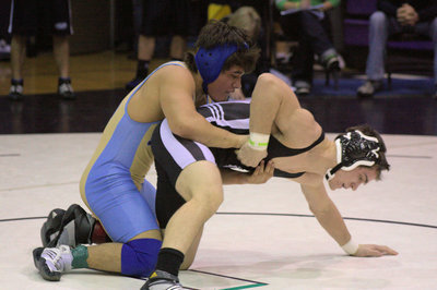 Image: Abraham Herrera taking down his opponent at the Divisional Tournament