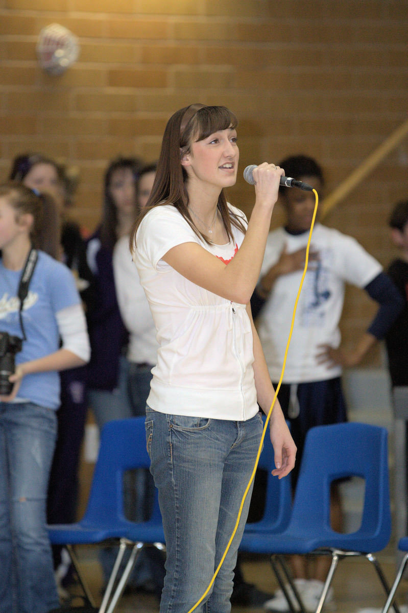 Image: Nicki Hopkins singing the National Anthem