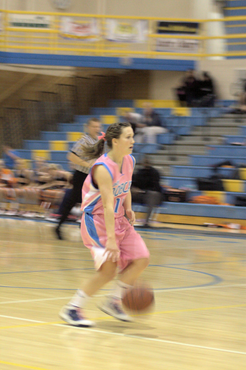 Image: Sydnee Johnson (#11) bringing the ball down the court