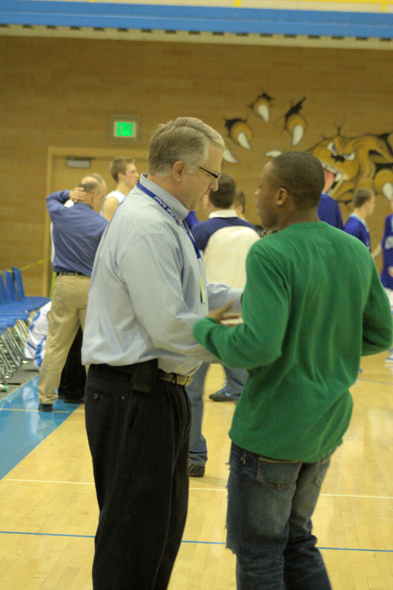 Image: Marcelle Crawford — Winner of lightning game accepts his prize from Principle Swensen