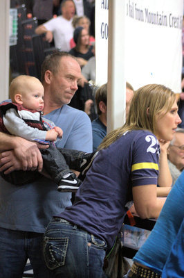 Image: Jordan Nielsen’s parents and nephew intently watching the game