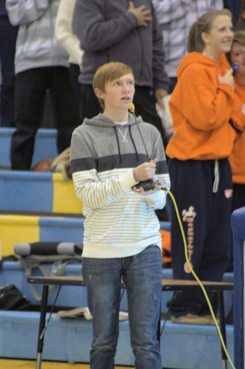 Image: James Sheppard sings the national anthem