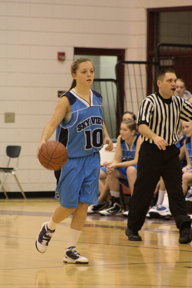 Image: McKenley Hellstern (#10) — Bringing it up court