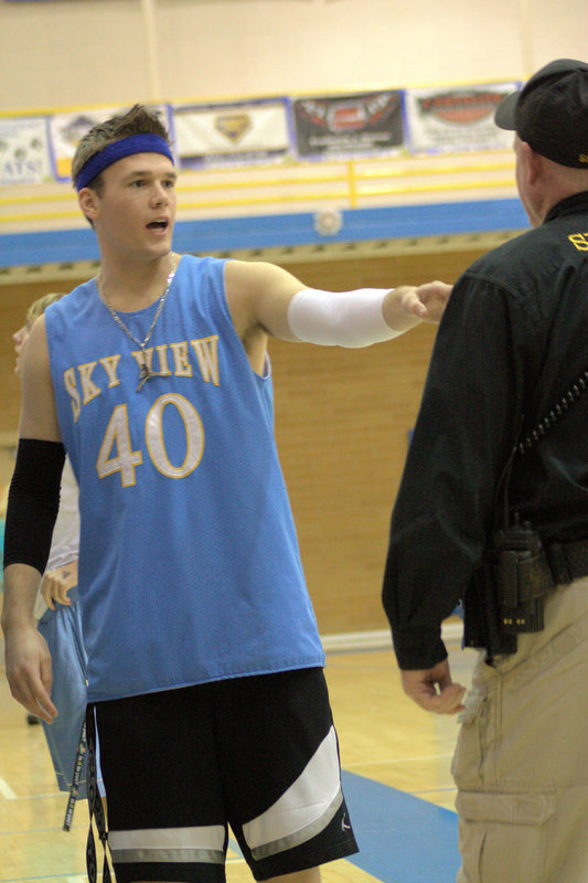 Image: Garyn Bennett joking with an officer before the game