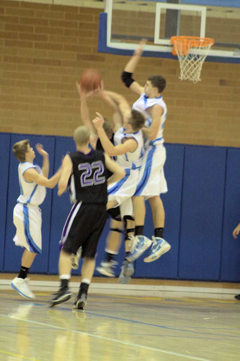 Image: Don Corbell &amp; Casey Oliverson block the shot