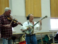 Image: Banjoman &amp; Co. — Dave Hunt on fiddle with the Banjoman, Dave Taylor, performing in the Smithfield Youth Center.