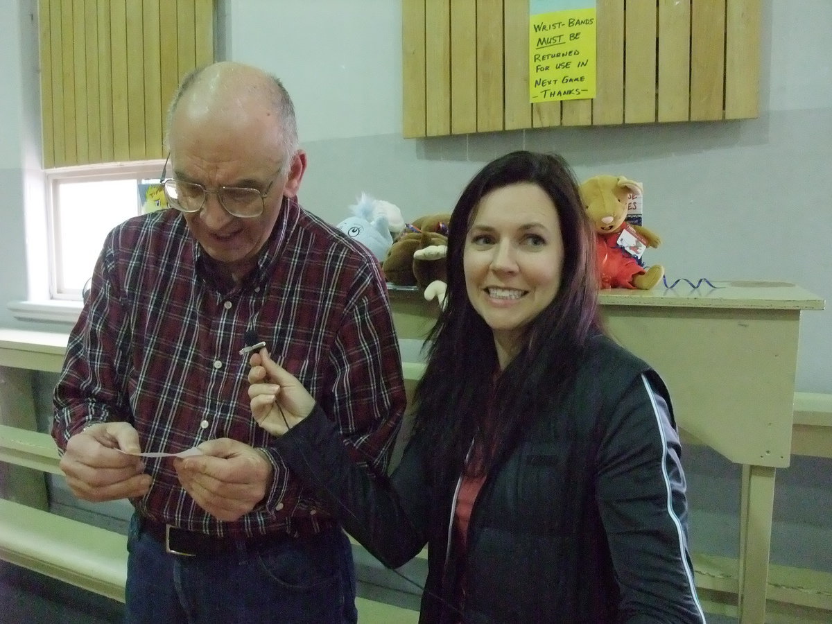 Image: Neilson and Housely — Library board members Arnold Neilson and Heather Housely drawing and reading names of the prize winners.