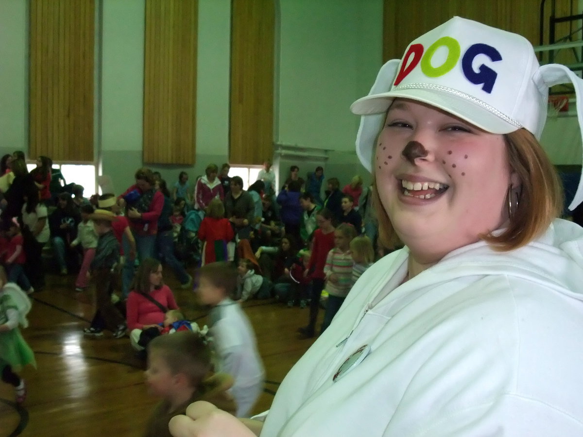 Image: Karen laughs — Karen laughs as the children race to the book table to get their own book.