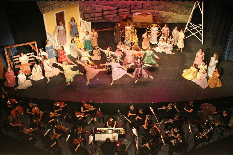 Image: Oklahoma! — Sky View’s orchestra and female cast perform one of the many great numbers from the musical — Oklahoma!