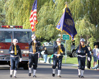 Image: American Legion — American Legion flag bearers lead the Sky View Homecoming Parade