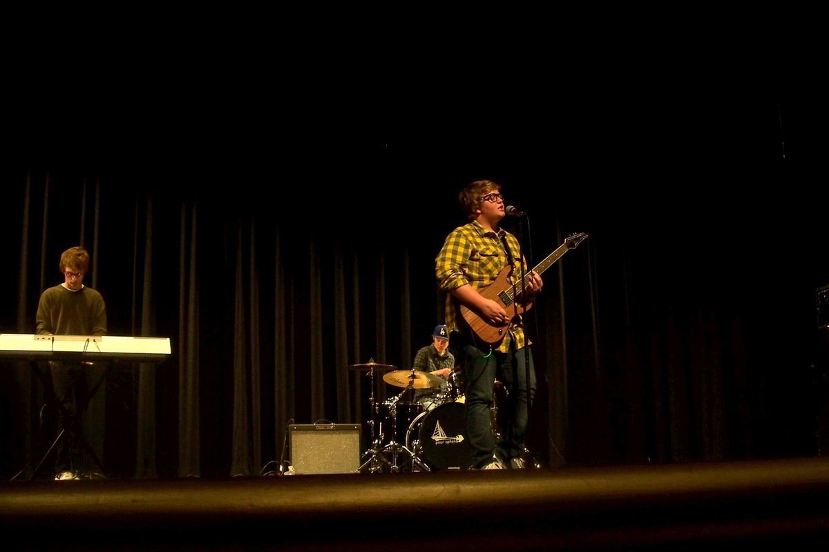 Image: Poor Ophelia at Regions — Poor Ophelia on stage at the PTSA region Battle of the Band at Davis High School in Kaysville.