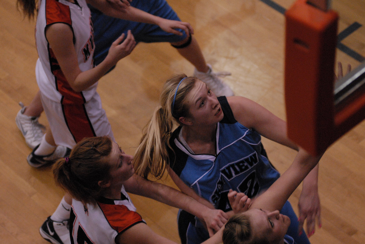 Image: Aubry Boehme — Senior center/forward Aubry Boehme fights for position under the basket.