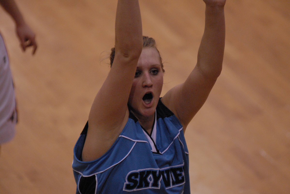 Image: Amy Andrus — Senior center/forward Amy Andrus puts up a foul shot to help secure a two-point victory over the Mustangs in girls basketball Thursday night.