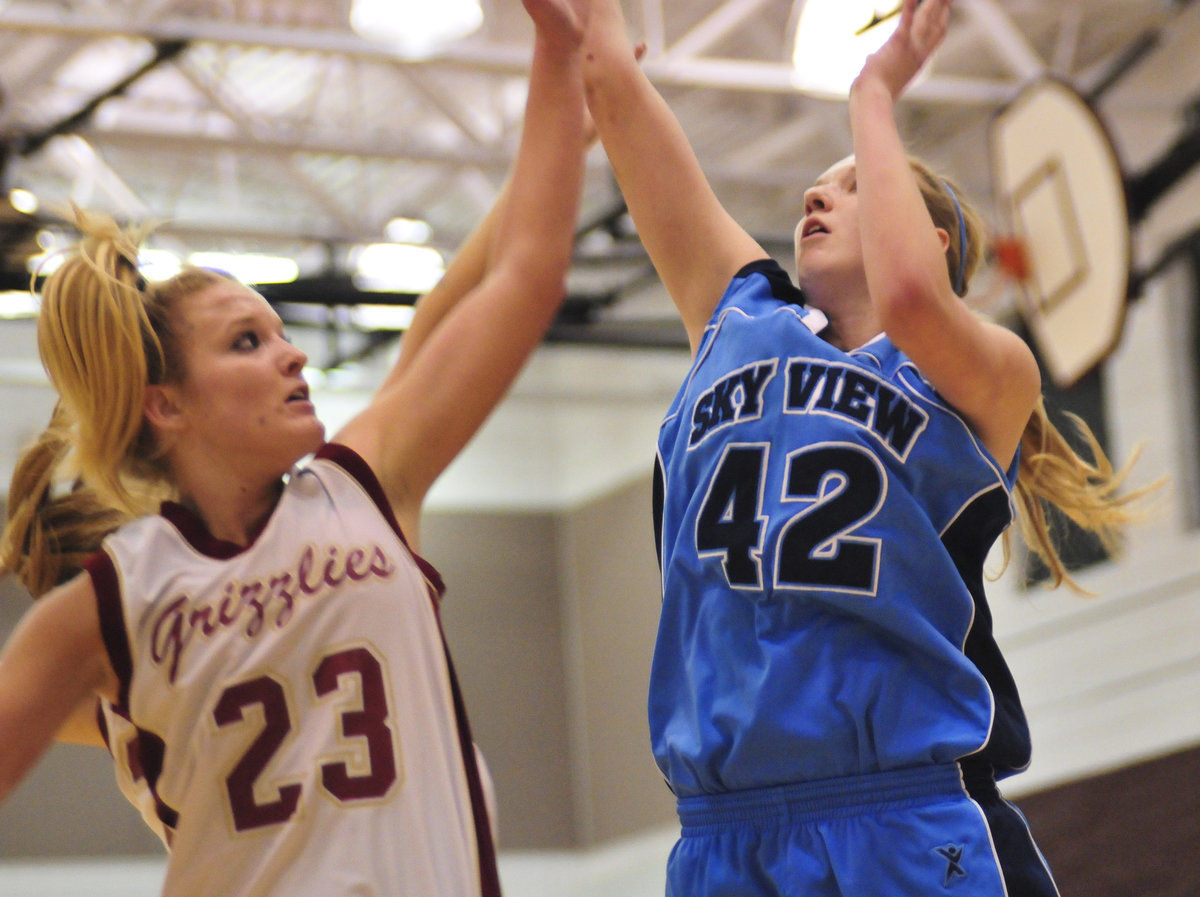 Image: Aubry Boeme — Senior guard Aubry Boeme puts up a shot over Logan’s Tonya Anderson.