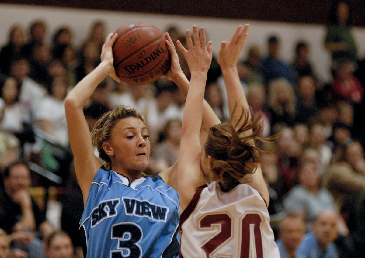 Image: Brittany Lews — Logan’s Mellisa Curtis guards Brittany Lews as some younger Bobcats get some court time.