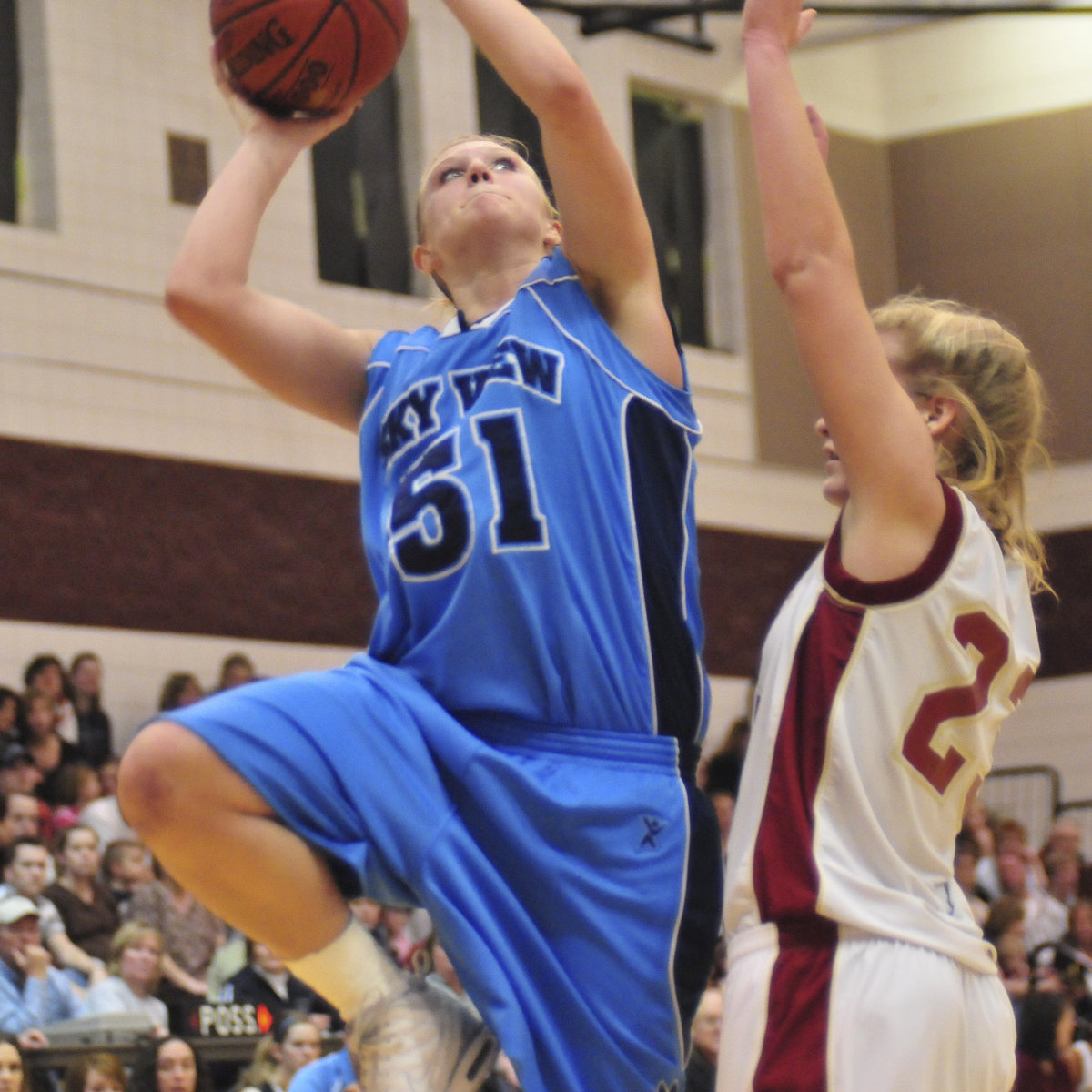 Image: Amy Andrus — Senior center/forward Amy Andrus shoots over Logan’s Tonya Anderson.