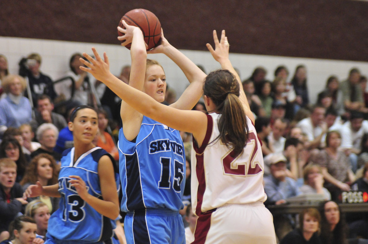 Image: Kaylee Merrill — Logan’s Kaylee Merrill guards junior forward/center Cortney Ballard.