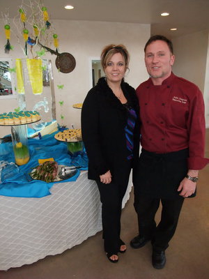 Image: John Simpson — John Simpson of Culinary Concepts and his wife in front of their catering display at the Castle Manor open house.