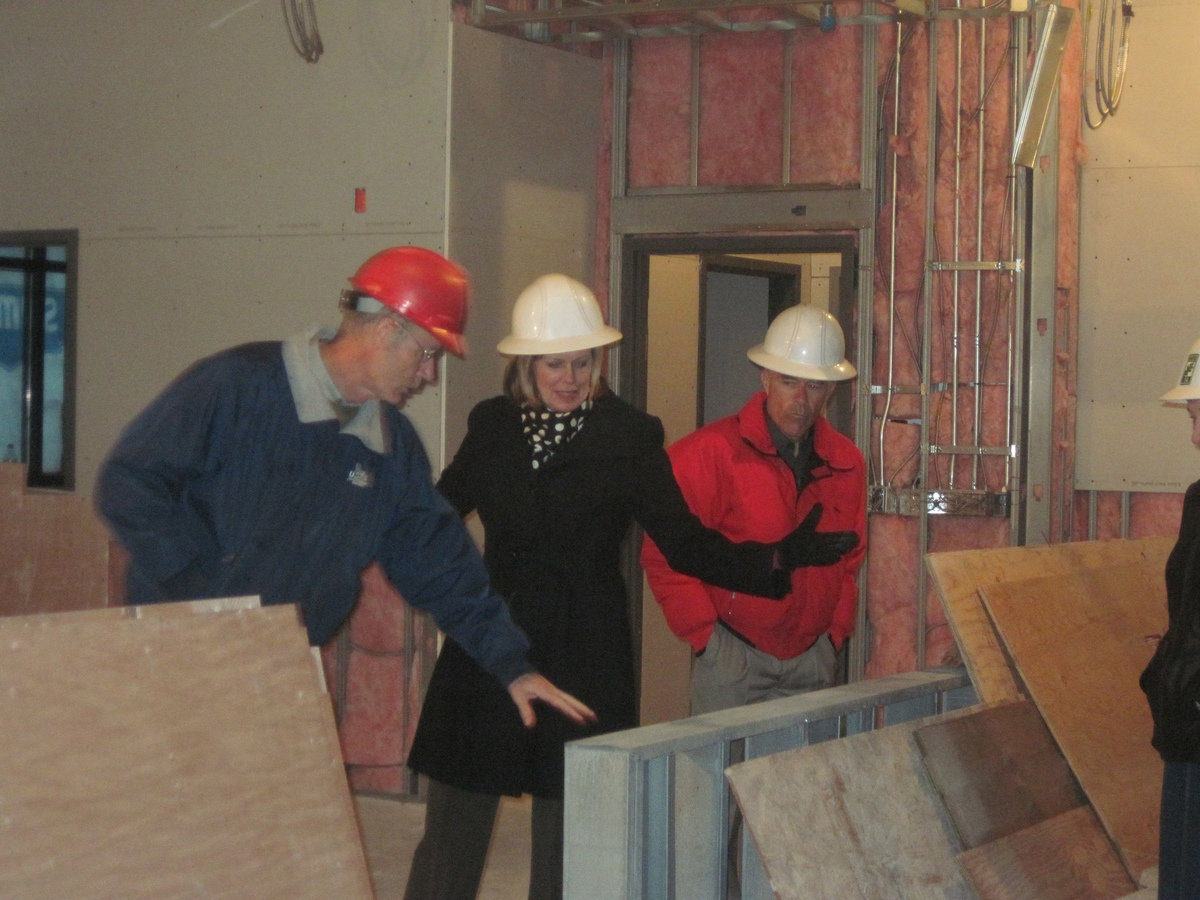 Image: Touring new city hall — City Manager Jim Gass gives Smithfield City Council a tour of the new city office building. City Councilwoman Kris Monson and City Councilman Michael Oliverson pictured in unfinished courtroom, which will be location of city council meetings.