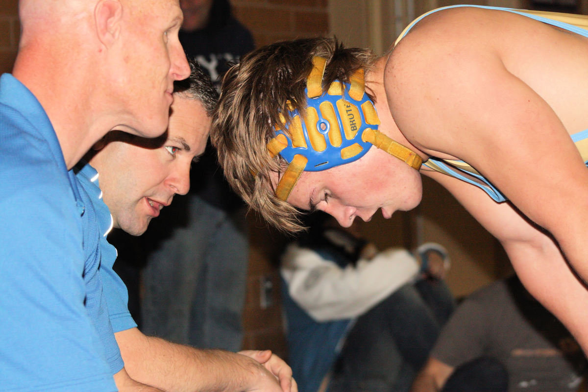 Image: Coaches Wright / Bagley — Coaches Kyle Wright and Bardett Bagley instruct Chet Anderson