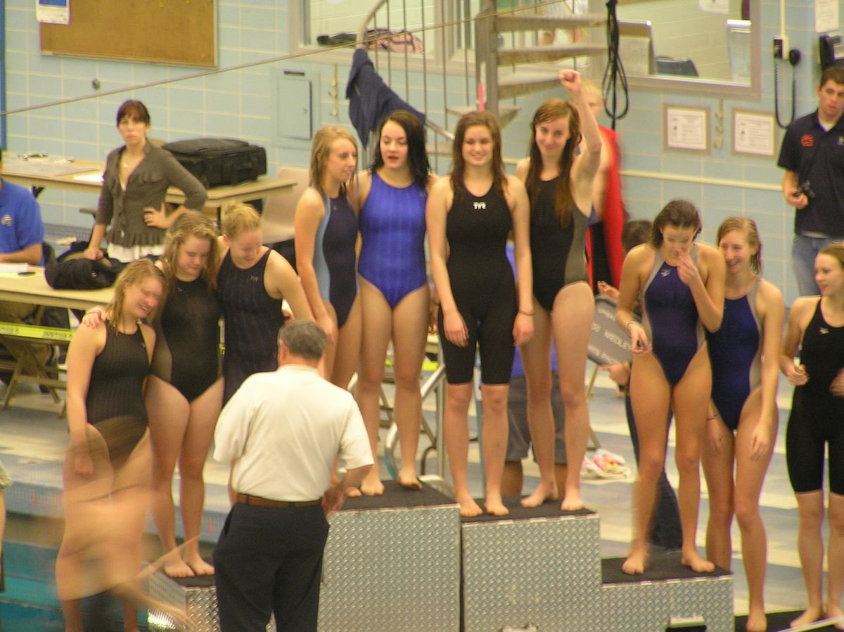 Image: Sky View 200 medley relay team — Sky View girls team on the stand (top center) for winning the 200 medley relay — Cassie Wiser, Shaelynn Bodrero, Mickensi Didericksen and Laura Mortenson.