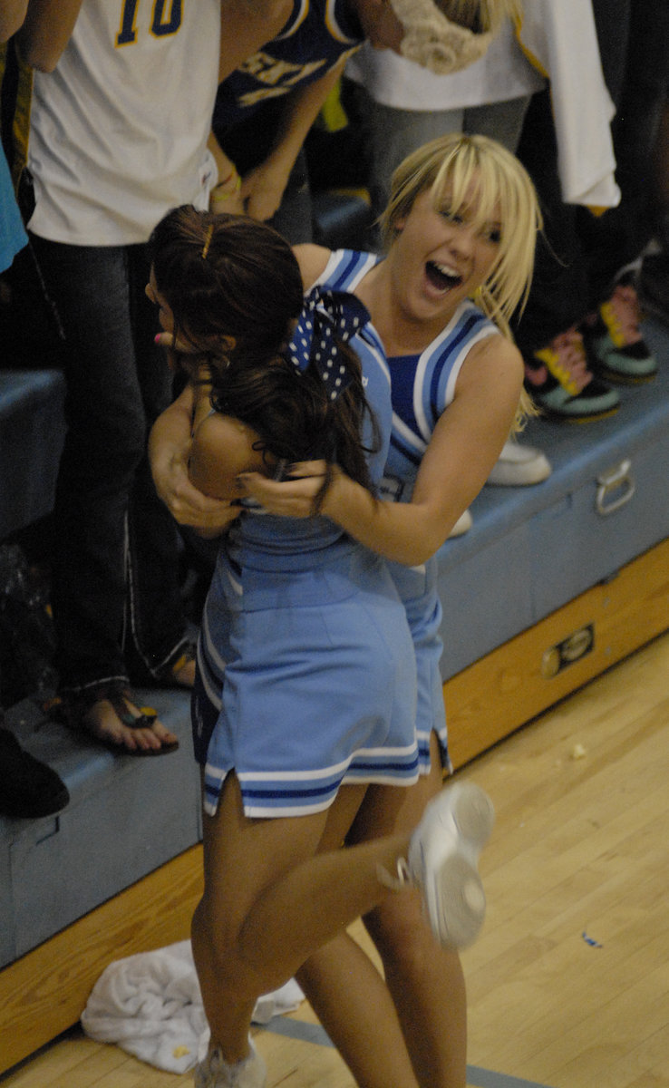 Image: Turnover celebration — Cheerleaders celebrate a turnover giving the Bobcats a chance when down by one with seconds on the clock.