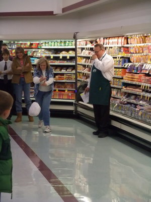 Image: Turkey bowling — Shoppers had fun playing games like bowling with frozen turkeys.