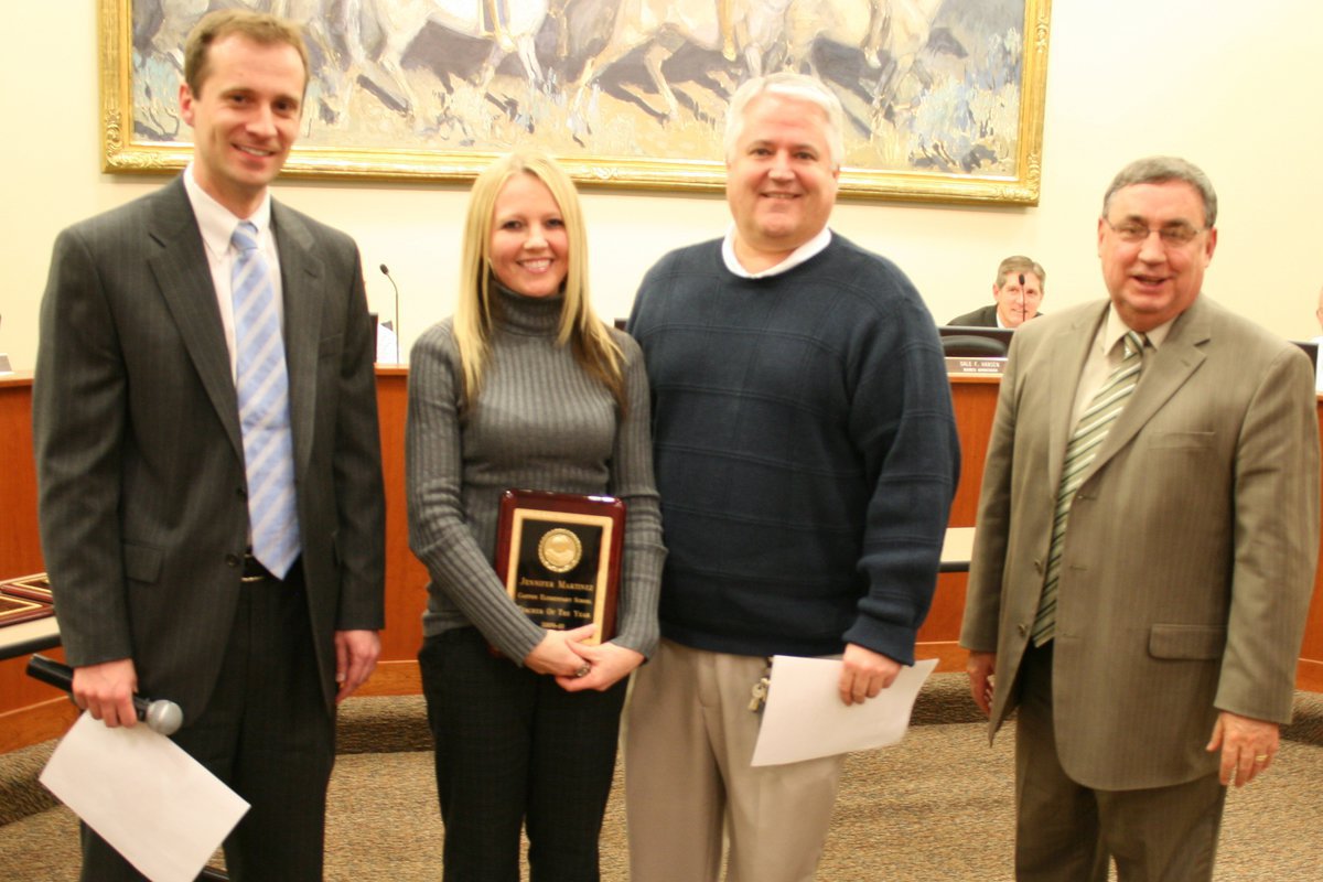 Image: Jennifer Martinez — Jonathan Jenkins, board president; Jennifer Martinez, 1st grade teacher; Kelly Rindlisbacher, principal; and Steve Norton, superintendent. Jennifer is holding her award as Teacher of the Year for Canyon elementary school.