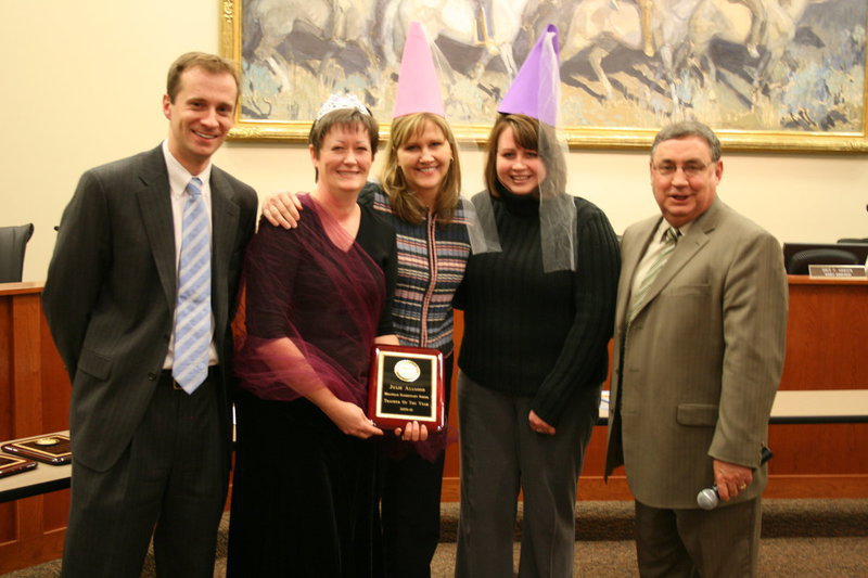 Image: Julie Allgood — Jonathan Jenkins, board president; Julie Allgood, kindergarten teacher; Maria Nelson, principal; Jennifer Jones, kindergarten teacher; and Steve Norton, superintendent. Julie holding her award as Teacher of the Year for Millville elementary school.