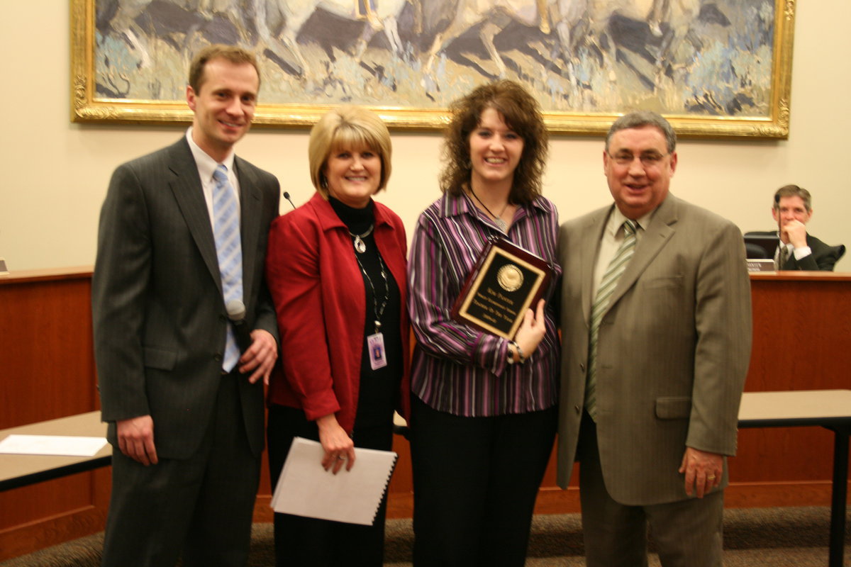 Image: Kim Panter — Jonathan Jenkins, board president; Sharyle Shaffer, principal; Kim Panter, 4th grade teacher; and Steve Norton, superintendent. Kim holding her award as Teacher of the Year for Nibley elementary school.