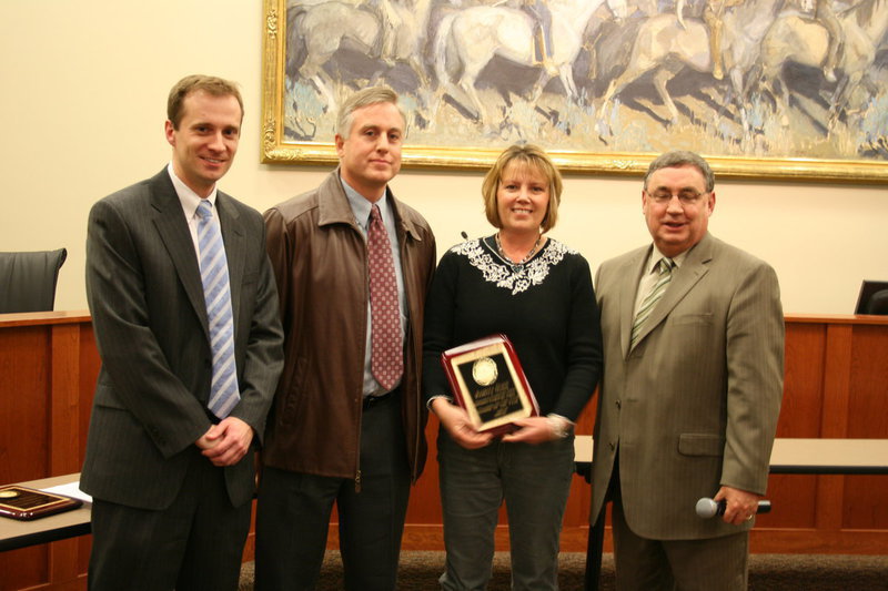 Image: Rebecca Olson — Jonathan Jenkins, board president; Curt Jenkins, principal; Rebecca Olson, 2nd grade teacher; and Steve Norton, superintendent. Rebecca holding her award as Teacher of the Year for Providence elementary school.