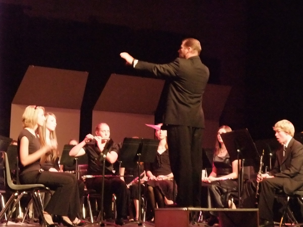 Image: Conducting both — Beach conducting the combined bands as they perform Salute to America’s Finest.