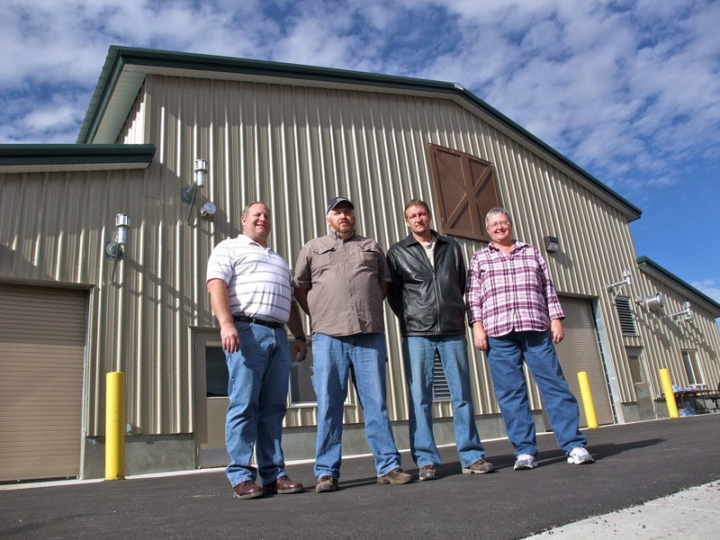 Image: Project finished — Mayor Mike Hall, Maintenance Superintendent Scott Ball, Councilman Brad Jensen, and Councilwoman Terrie Wierenga stand in front of the newly completed wastewater treatment plant for Richmond, Utah.